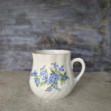 Zsolnay pocakos porcelánbögre nefelejcs mintával