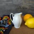 Sárga virágos porcelán tejkiöntő